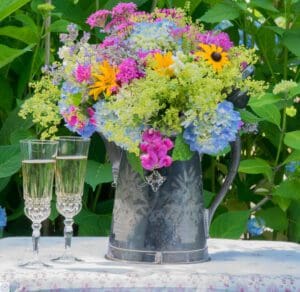 Colorful wildflowers in metal pitcher