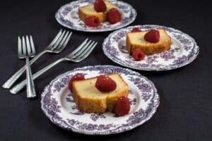 Cake slices with raspberries on plates