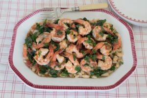 Seafood dish with herbs and beans