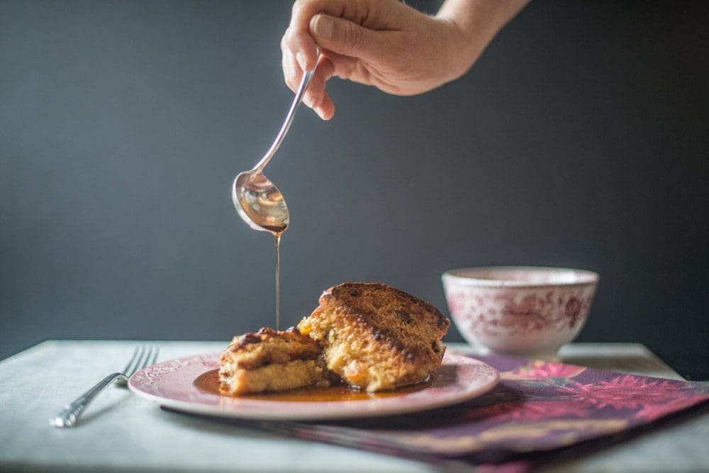 Pouring syrup over French toast breakfast