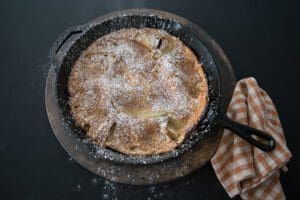 Apple pancake dusted with powdered sugar