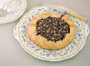 Homemade tart with blueberries and lemon zest