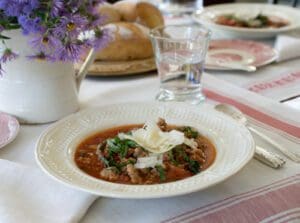 Hearty soup with fresh herbs and cheese