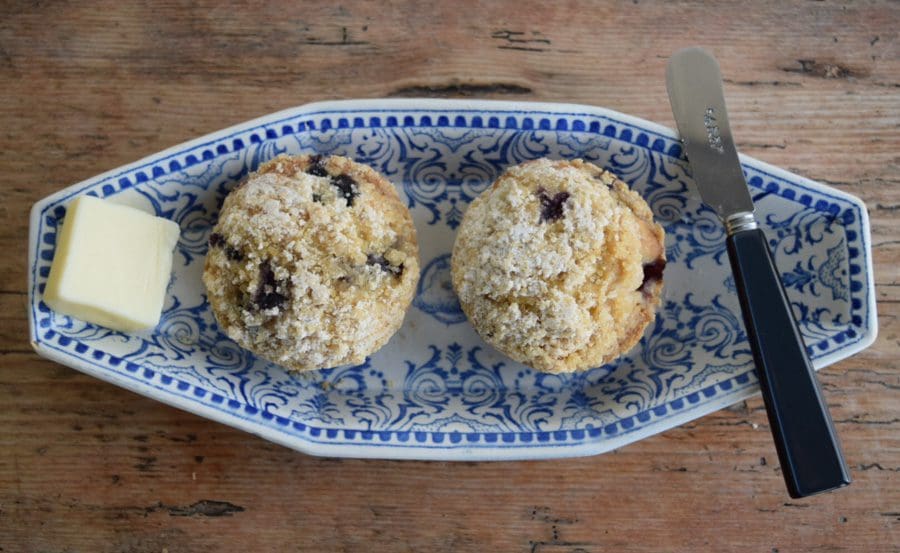 Muffins with butter and knife