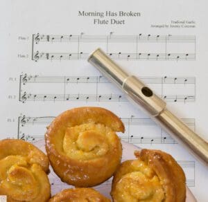 Flute duet sheet and pastries