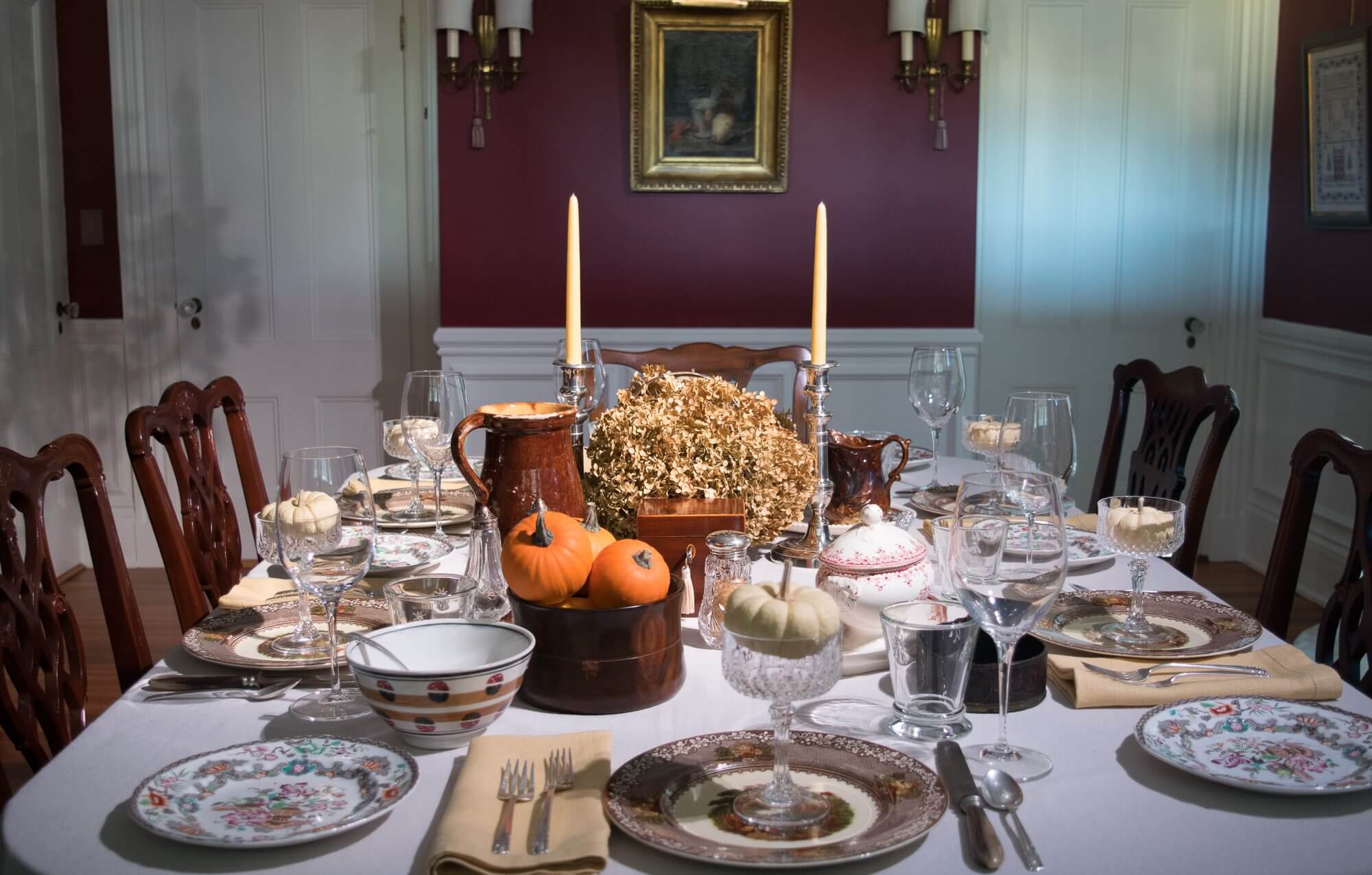 Thanksgiving dinner setup with pumpkins