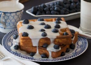 Blueberry waffles on patterned plate