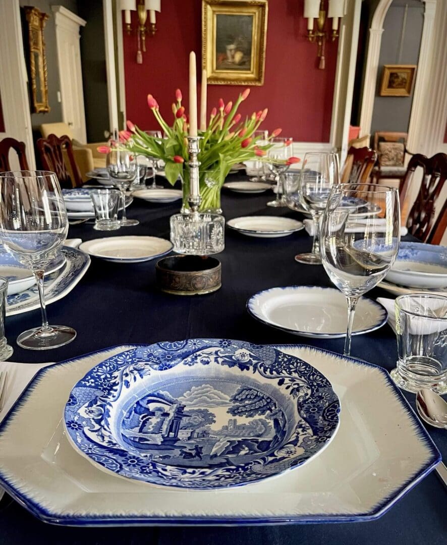 Elegant table setting with blue-patterned plates.