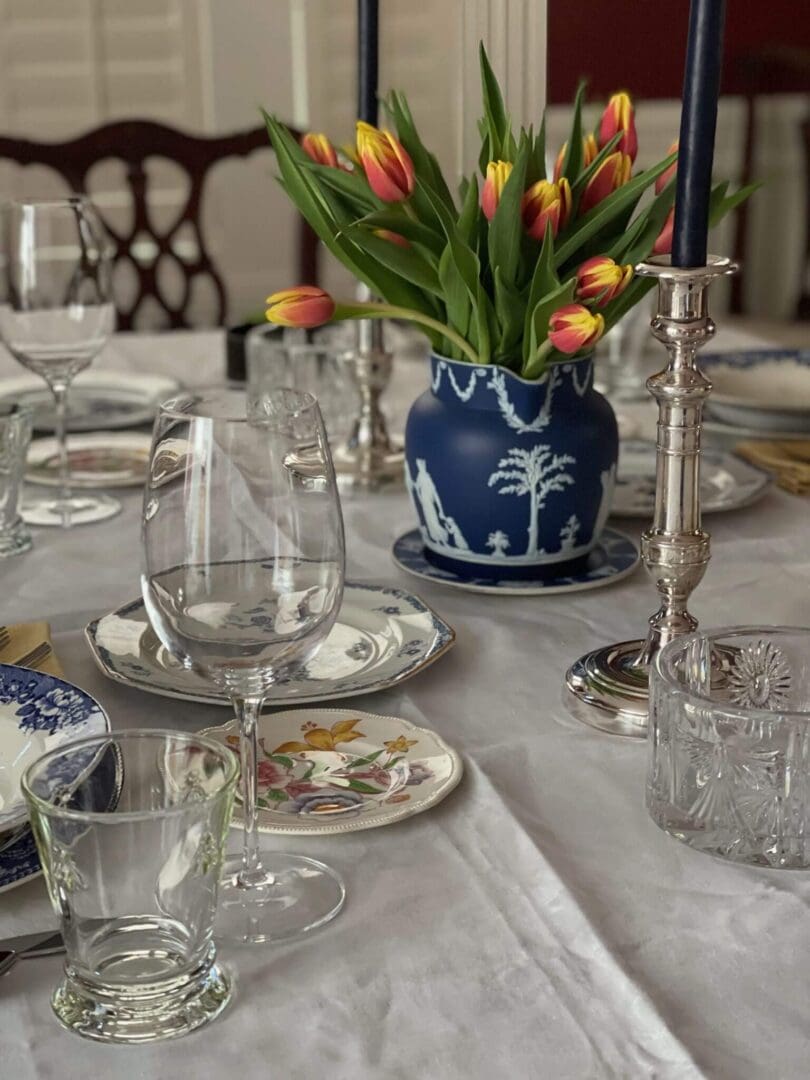 Elegant table setting with tulips and candles.