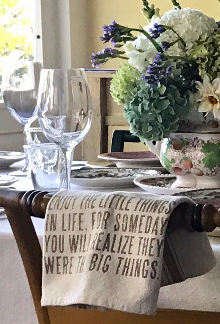 Elegant table setting with inspirational quote napkin.