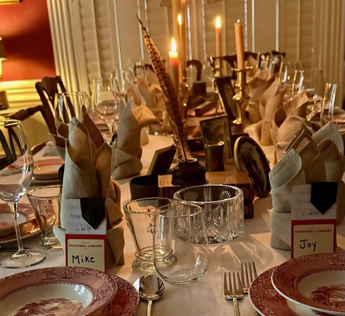 Elegant dining table with candlelight and settings.