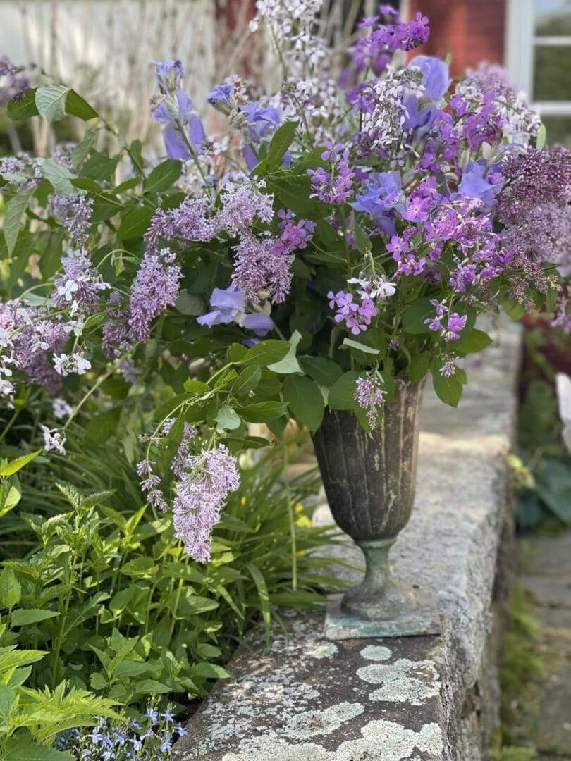 Purple and lavender flowers in a vase.