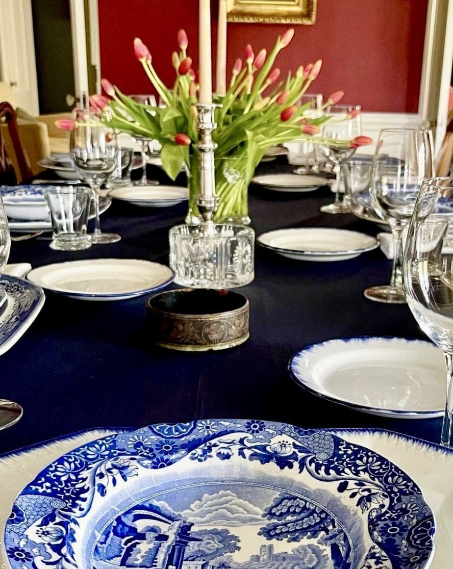 Elegant table setting with tulips and china.