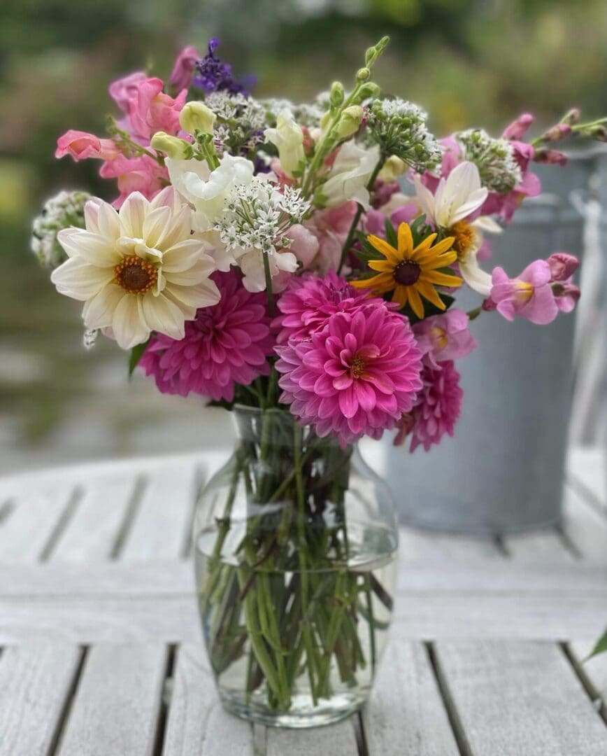 Bouquet of colorful flowers in glass vase.